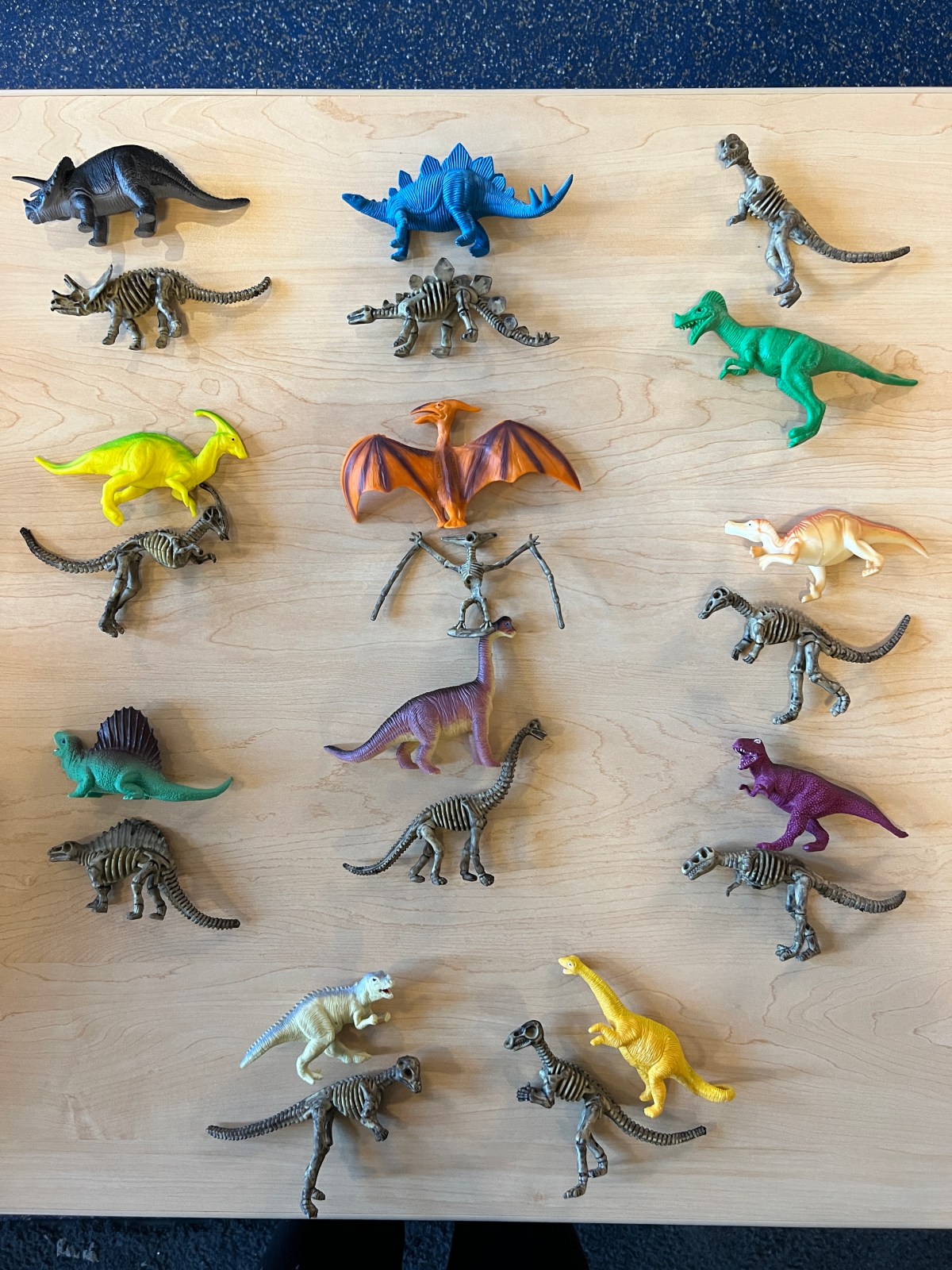 A eulogy for Psittacosaurus, devoured by Deinonychus in the Colossal Book of Dinosaurs (Brenden Layte)